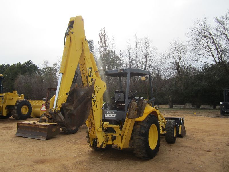 NEW HOLLAND 555E 4X4 LOADER BACKHOE, S/N 31027327, MULTI PURPOSE BUCKET, 24" HOE BUCKET, CANOPY