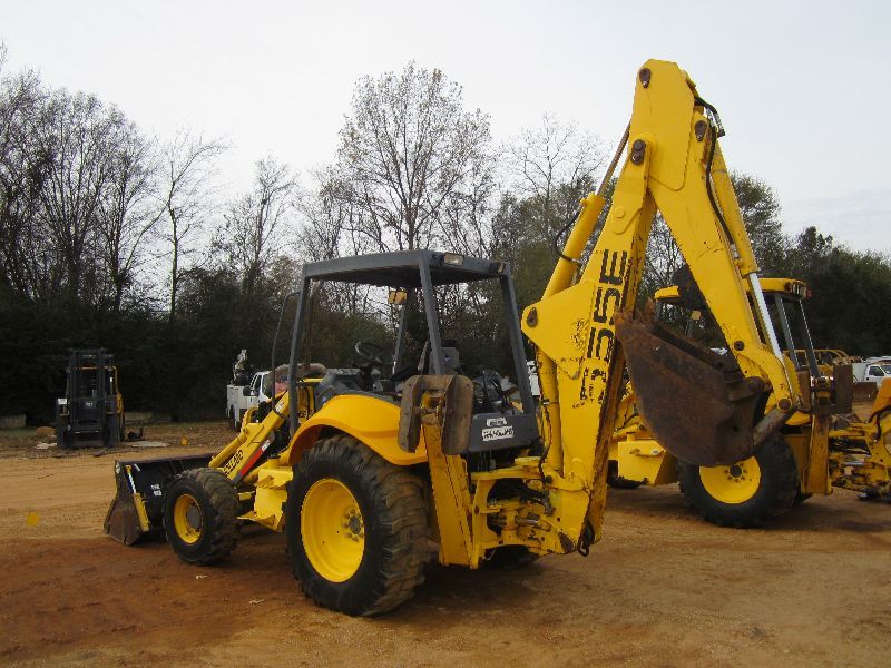 NEW HOLLAND 555E 4X4 LOADER BACKHOE, S/N 31027327, MULTI PURPOSE BUCKET