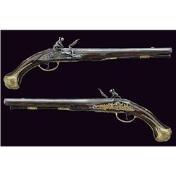 A fine pair of engraved flintlock pistols