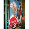 Image 1 : Coca cola sign with spritey boy