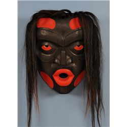 Kwaguilth Dzunukwa Mask, Wild Woman, with Horsehair Carved by Gene Brabant 22 1/2" H. 17 1/2" W.  Go