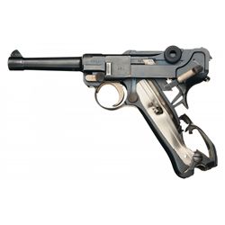 Unique 1915 Dated DWM Luger Pistol with Holster, Extra Magazine, and Extensive Battle Damage