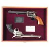 Image 1 : Two Commemorative Colt Single Action Army Revolvers with a Shared Presentation Case