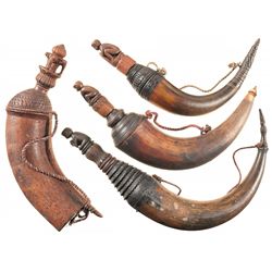 Four Unique Powder Horns with Carved Figural Plugs