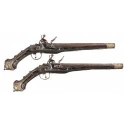 Attractive Pair of Chieftain Grade Ornate Arabic Flintlock Pistols with Relief Chiseling Silver Deco