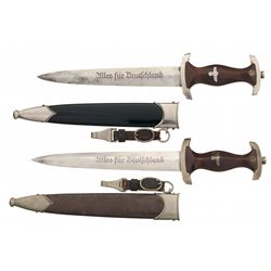 Two Nazi Daggers with Scabbards and Belt Hangers