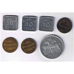 Lot of 7 Quebec trade tokens.