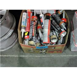 Box full of assorted construction adhesives