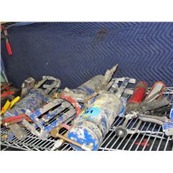 Shelf lot of construction adhesive compound guns