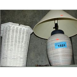 Ceramic table lamp and a white wicker laundry