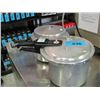 Image 1 : 2 pressure cookers with assorted dishes inside