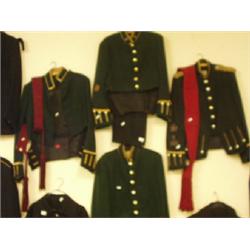 Four green Black Watch officers' jackets, two sashes and two pairs of trousers £100 - 150...