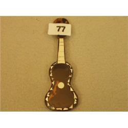 Tortoiseshell miniature guitar with mother of pearl inlay £40 - 60...