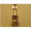 Image 1 : Tortoiseshell miniature guitar with mother of pearl inlay £40 - 60...
