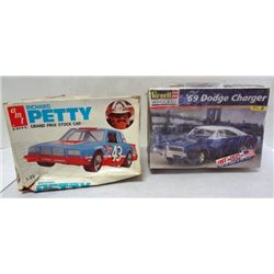 2 MODEL CAR KITS.  BOXES NOT IN GOOD COND.  CARS STILL NICE.