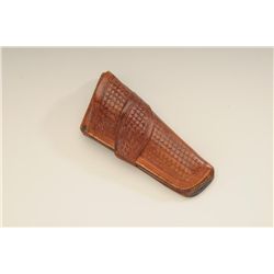 Basketweave leather single loop holster for a  Colt SAA revolver marked on reverse “S.A.  Wade, MAKE