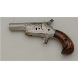 Colt Third Model Derringer in .41 rimfire  caliber, nickel plated, wood grips. The  Derringer retain