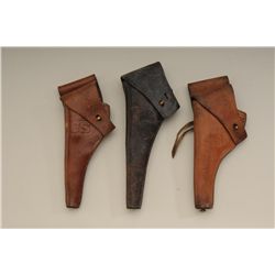 Lot of three U.S. military leather holsters  including a flap holster with two position  flap for Co