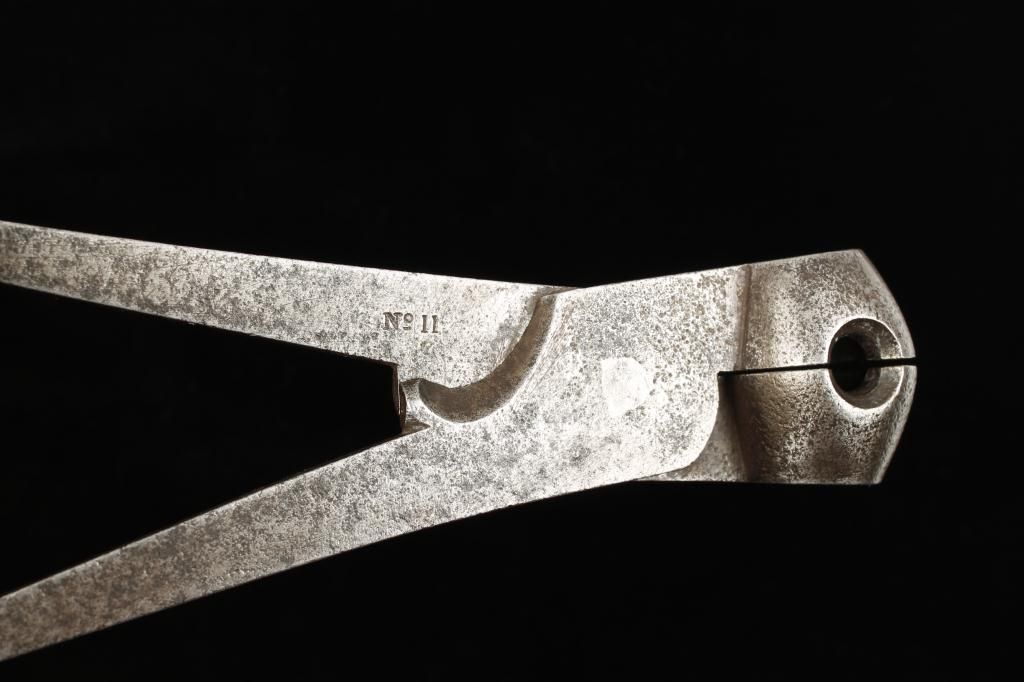 Scissor type bullet mold marked number 11 and W.D. for British war ...