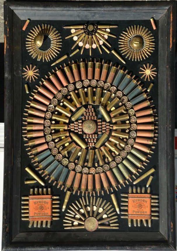 Antique bullet board featuring Kynoch cartridges, shotgun shells