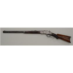 Winchester Model 1873 Deluxe lever action  rifle, .32-20 cal., 24” octagon barrel, blue  and case ha