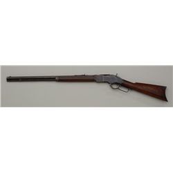 Winchester Model 1873 lever action rifle, .32  W.C.F. cal., 24” octagon barrel, blue  finish, wood s