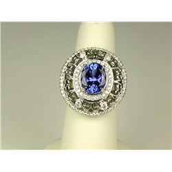 Spectacular 14 karat white gold ladies custom  made ring set with a fine oval Tanzanite  weighing ap