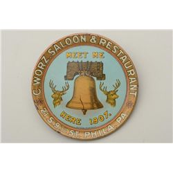 Early 1900’s metal color tip tray, approx.  4-1/4” in diameter advertising C. Wortz  Saloon & Restau