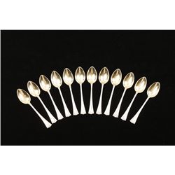 Lot of 12 Sterling Silver Demitasse spoons  showing German hallmarks with gold gilt bowls  and fancy