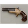 Image 1 : Early Colt #3 Derringer with high hammer and  curved grip. Serial number 14795. The barrel  retains 