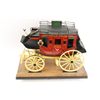 Image 3 : Handmade and carved from wood miniature  stagecoach with painted decoration displaying  “Wells Fargo