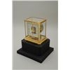 Image 1 : High quality Le Coultre perpetual motion  window clock with gold plated brass mountings  and see-thr