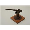 Image 1 : Metal model of a WW I-era submarine cannon on  wood base, approx. 8” in height with a 12”  barrel th