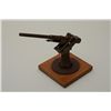 Image 2 : Metal model of a WW I-era submarine cannon on  wood base, approx. 8” in height with a 12”  barrel th