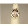 Spectacular 18 karat yellow gold ladies ring  set with a large pink Kunzite weighing 15.34  carats a
