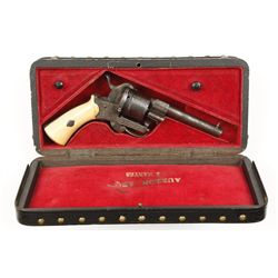 Cased silver and gold inlaid, double action  pin-fire revolver with ivory grips in 7.5 mm  pin-fire 