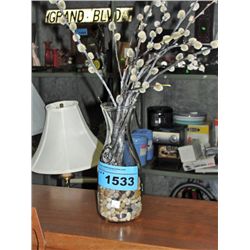 Glass bottle display of dried pussy willows