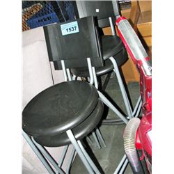 4 grey metal and black bar stools
