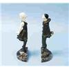Image 1 : MARCEL BOURAINE - A pair of bronze and ivory bookends depicting a boy and a girl in period costume..