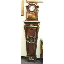 An important antique mahogany and gilt bronze regulator. Bronze mounting with stylized cupids, execu