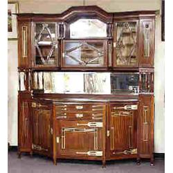 VIENNA SECESSION - A large antique Austrian mahogany sideboard. The serpentine base with closed cupb