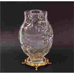 ART NOUVEAU - BACCARAT, FRANCE. A crystal vase mounted on gilt bronze base. The flask shaped vase in