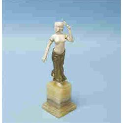 ART DECO - L. SOSSON. A fine bronze and ivory sculpture of a seminude dancer raised on an onyx base.