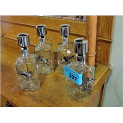 4 glass pump top liqour decanters with wild bird
