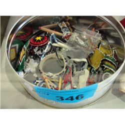Tin full of assorted beaded bracelets