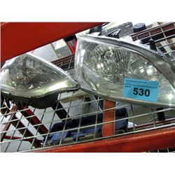 Pair of honda headlight assemblies