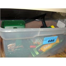 Clear plastic storage bin of assorted garden