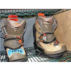 Pair of snowboard boots with burton bindings