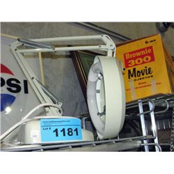 Adjustable arm lighted magnifying lamp