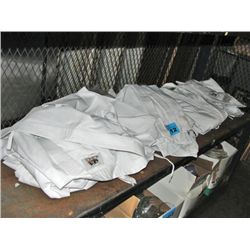 Shelf lot of white martial arts uniforms